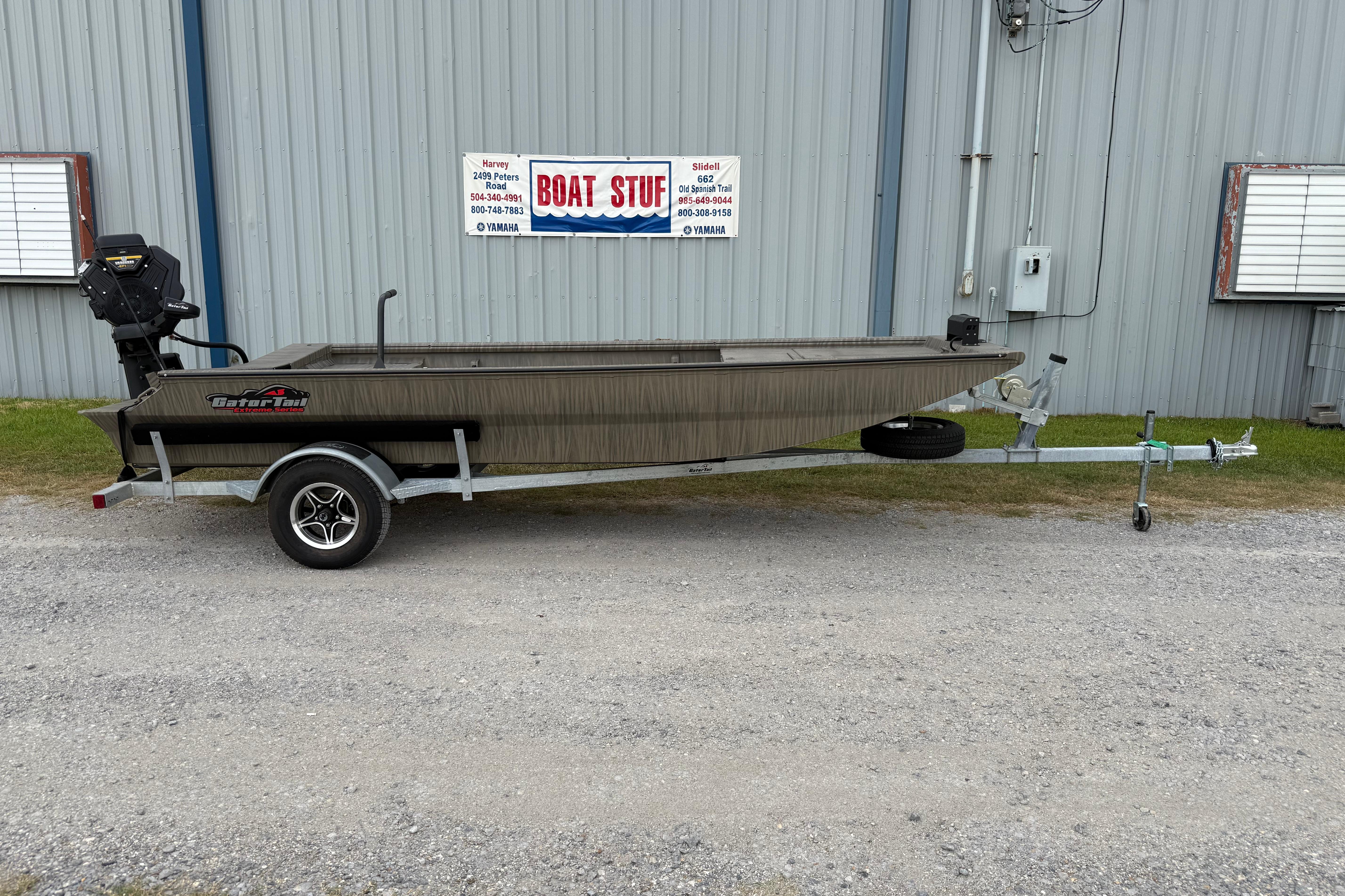 Gator-tail 1754 Extreme 2026 Gator Tail 1754 Extreme boat on trailer outside a metal building.
