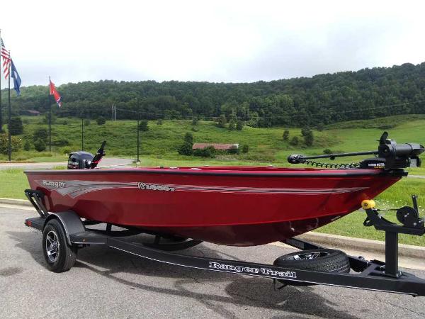 Ranger VS1665T 2024 Ranger VS1665T red fishing boat on trailer in scenic outdoor setting.
