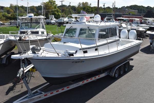 Steiger Craft 31 Miami 2023 Steiger Craft 31 Miami boat on trailer, parked in marina.
