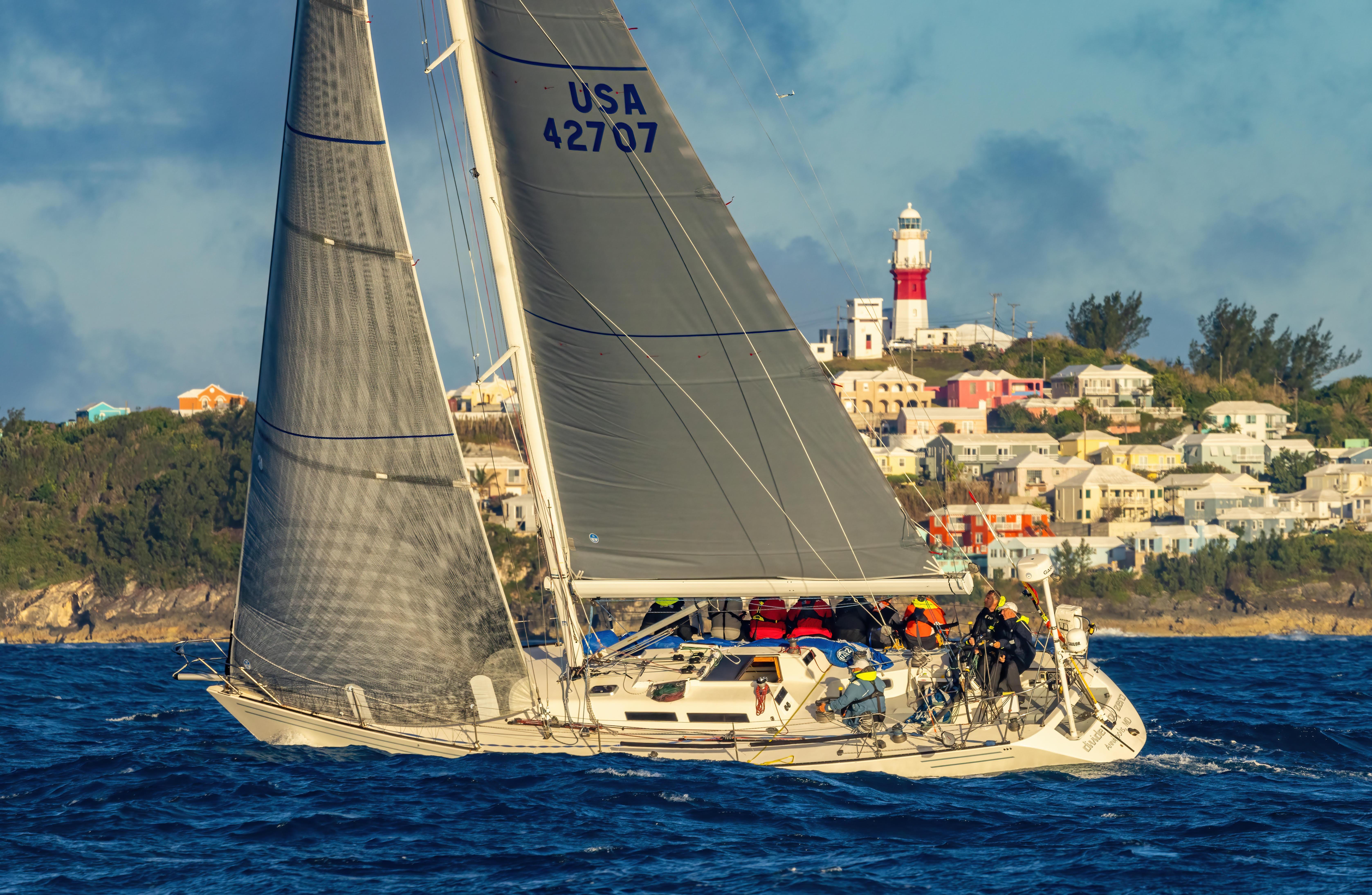 Carroll Marine 45' Frers 45 Sailboat Carroll Marine Frers 45, 1990, sailing near colorful coastal town and lighthouse.