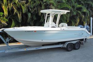 Robalo 2020 Center Console 2020 Robalo Center Console boat on trailer, parked near lush greenery.