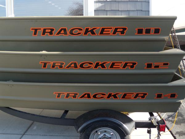 Tracker Grizzly 1036 Jon 2024 Tracker Grizzly 1036 Jon boats stacked on a trailer.