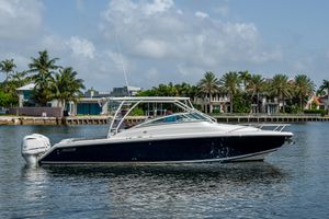 Jupiter 34 LX 2016 Jupiter 34 LX boat on calm water with palm trees in the background.