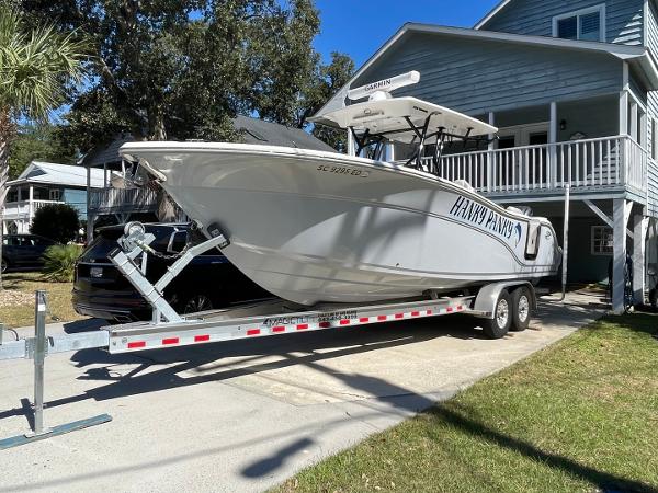 Sea Fox 288 Commander 2024 Sea Fox 288 Commander boat on trailer in residential driveway.