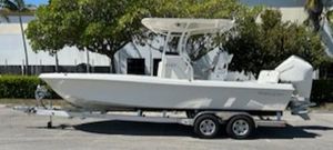 Ranger 2360 Bay 2024 Ranger 2360 Bay boat on a trailer in a parking lot.