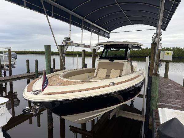 Chris-Craft Catalina 30 2024 Chris-Craft Catalina 30 boat docked under a canopy.