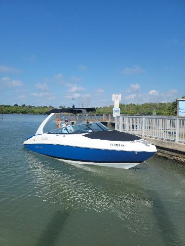 Rinker QX 26 2018 Rinker QX 26 boat docked on a sunny day.