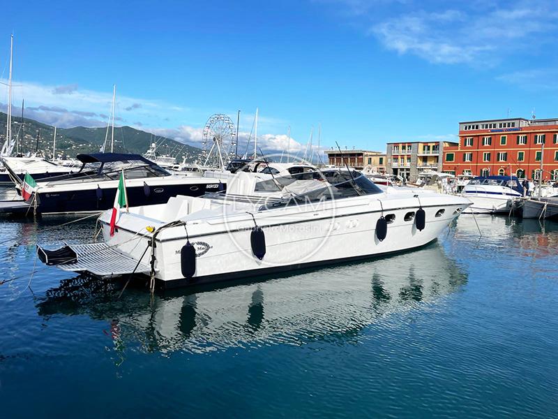 Magnum Magnum 40 Sport 1989 Magnum 40 Sport yacht docked in a scenic marina with clear blue skies.