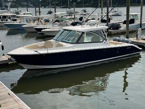 Pursuit DC 325 Dual Console 2018 Pursuit DC 325 Dual Console boat docked in a marina.