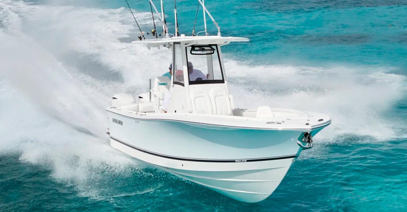 Regulator 25 2026 Regulator 25 boat cruising on clear turquoise waters.