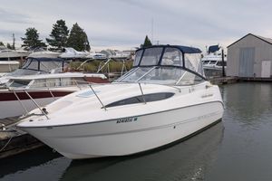 Bayliner 245 Ciera 2004 Bayliner 245 Ciera boat docked at marina, featuring sleek design and enclosed cabin.