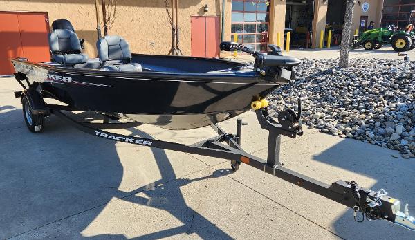 Tracker Super Guide V-16 T 2025 Tracker Super Guide V-16 T boat on trailer, parked outdoors.
