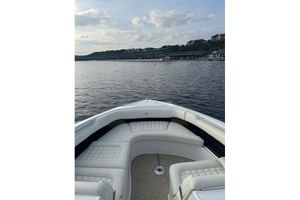 Cobalt R30 2017 Cobalt R30 boat with white seating on a calm lake.