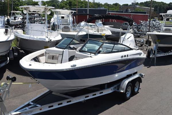 Monterey M-205 2025 Monterey M-205 boat on trailer in a marina.