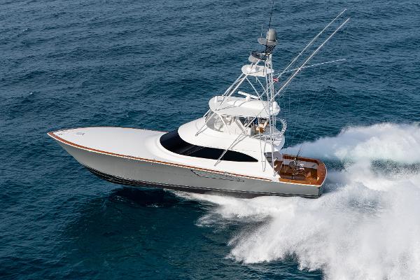 Viking 64 Convertible 2025 Viking 64 Convertible yacht cruising swiftly on open ocean waters.