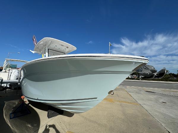 Sea Fox 248 Commander 2025 Sea Fox 248 Commander boat on display under clear blue sky.