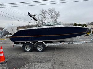 Four Winns H2 OB 2025 Four Winns H2 OB boat on trailer, parked outdoors.