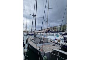 Mylius 11E25 Sailboat Mylius 11E25, 2006 model, docked in a marina under cloudy skies.