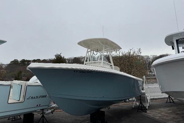 Sailfish 220 CC 2024 Sailfish 220 CC boat displayed outdoors on a cloudy day.