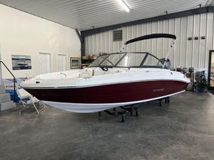 Stingray 191 DC 2026 Stingray 191 DC boat in showroom, red and white design, indoor display.