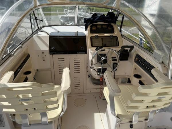 Grady-White Voyager 248 2002 Grady-White Voyager 248 boat cockpit with dual seats and steering wheel.