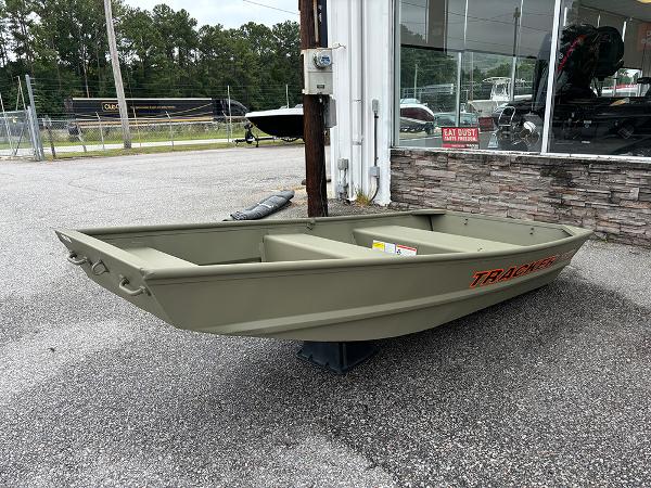Tracker Grizzly 10 Jon 2025 Tracker Grizzly 10 Jon boat displayed outdoors near a showroom.
