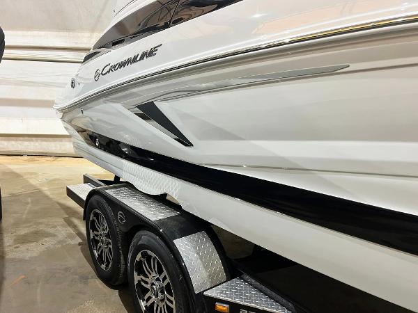 Crownline 270SS 2024 Crownline 270SS boat on trailer, showcasing sleek design and modern features.