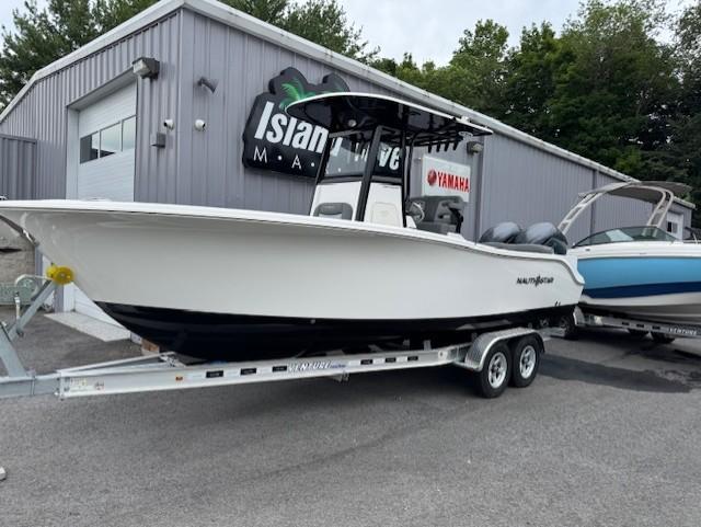 NauticStar 252 Legacy 2024 NauticStar 252 Legacy boat on trailer outside dealership.