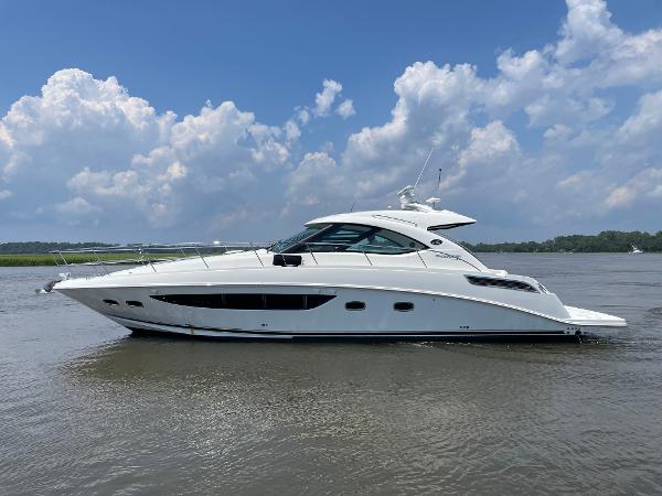 Sea Ray 470 Sundancer 2014 Sea Ray 470 Sundancer yacht on calm water under a cloudy sky.