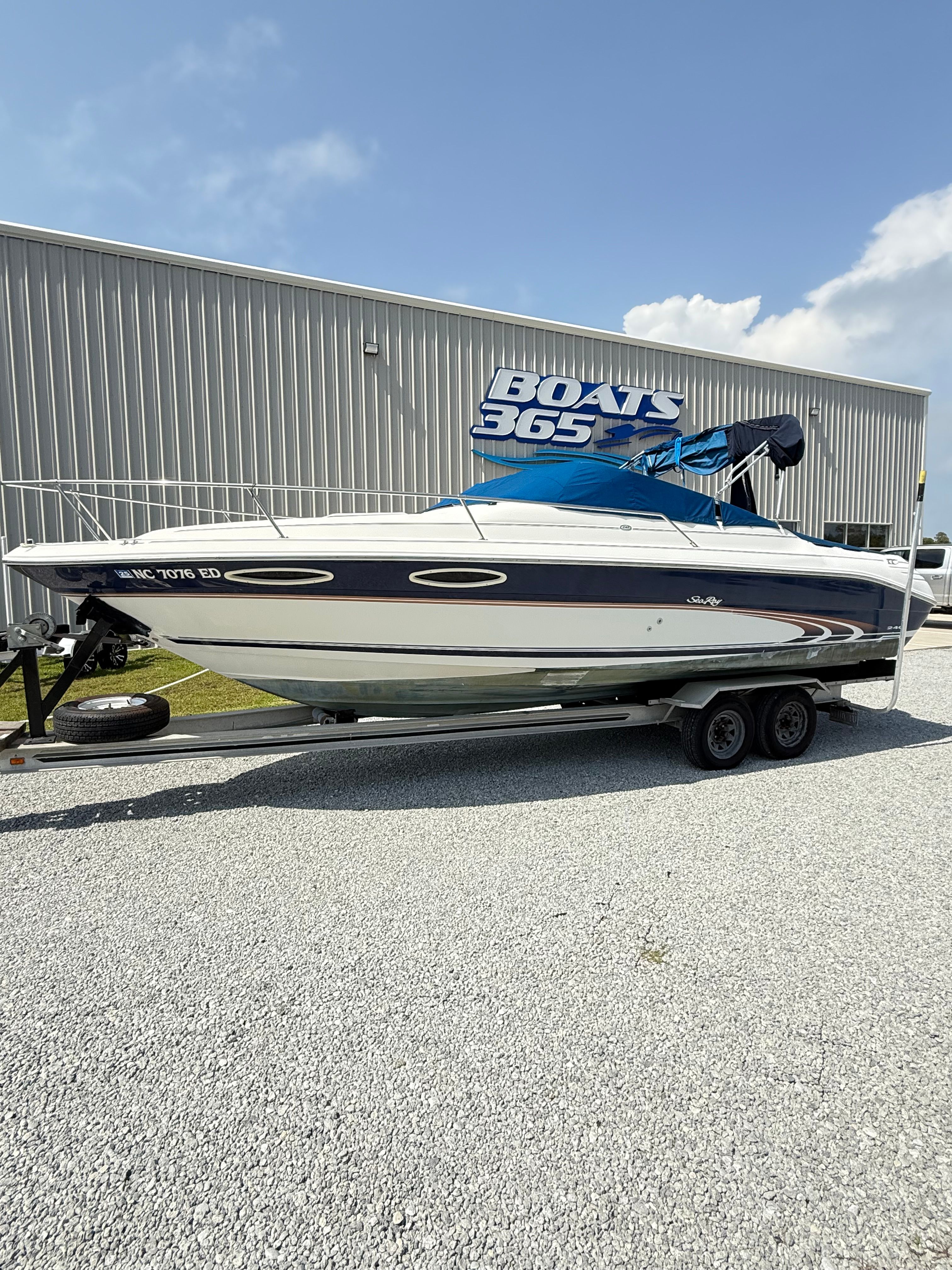 Sea Ray 240 Signature 1997 Sea Ray 240 Signature boat on trailer, parked outside Boats 365 building.