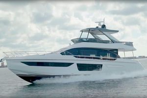 Azimut Fly 68 2024 Azimut Fly 68 yacht cruising on open water under a cloudy sky.