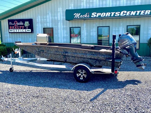 Xpress H16DB w/ Convenience Station 2025 Xpress H16DB boat with trailer outside Mack's Sports Center.