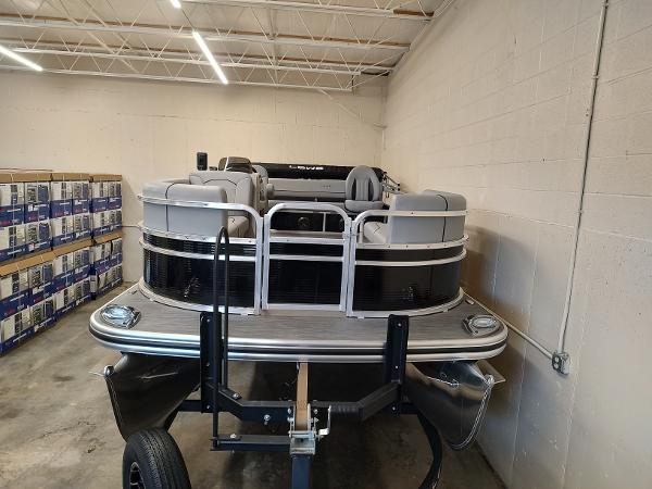 Lowe UC180 2025 Lowe UC180 boat stored indoors on a trailer in a warehouse.