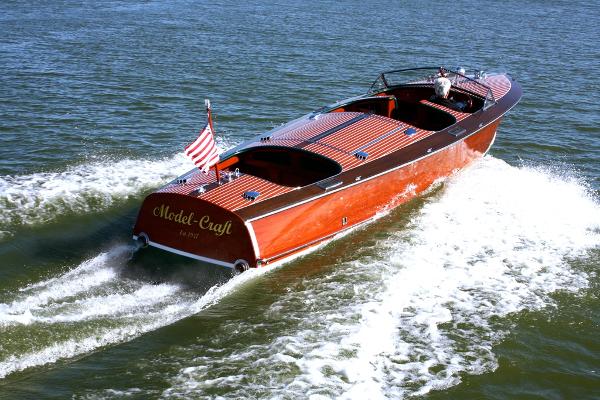 Grand Craft 27 Custom Grand Craft 27 Custom 2013 boat cruising on open water with American flag.