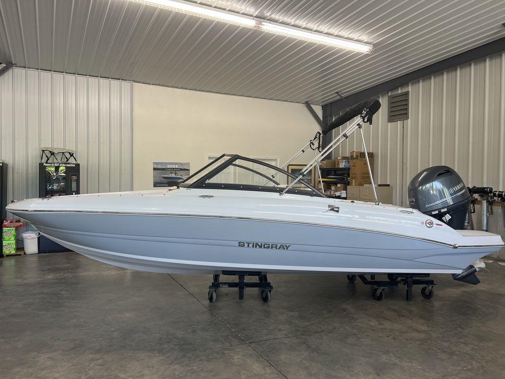 Stingray 191 DC 2026 Stingray 191 DC boat in a showroom, side view, with Yamaha outboard motor.
