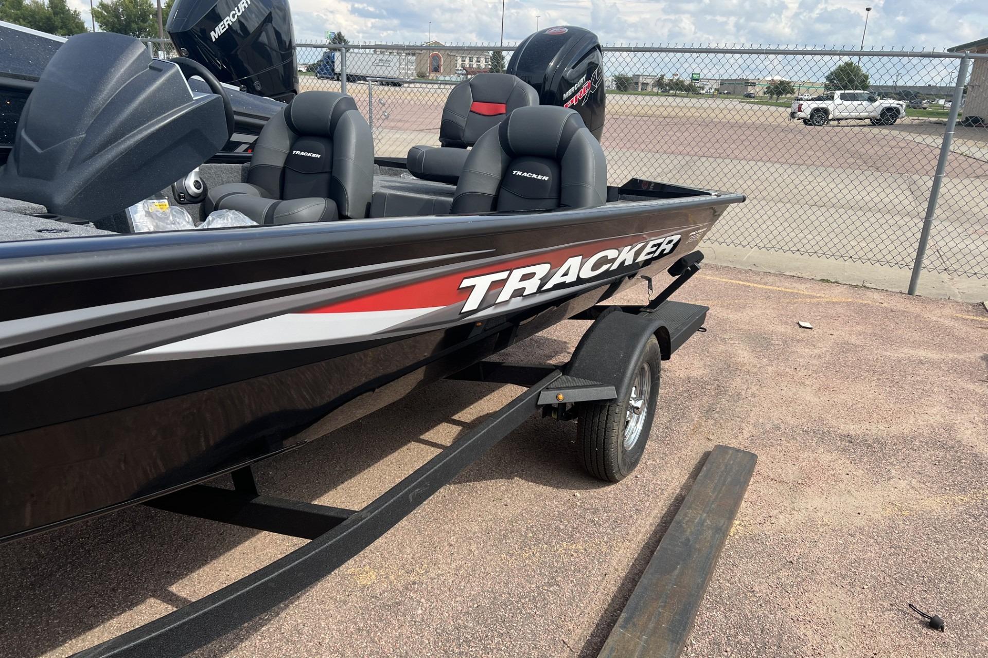 Tracker Pro Team 190 2026 Tracker Pro Team 190 boat on trailer, parked outdoors.