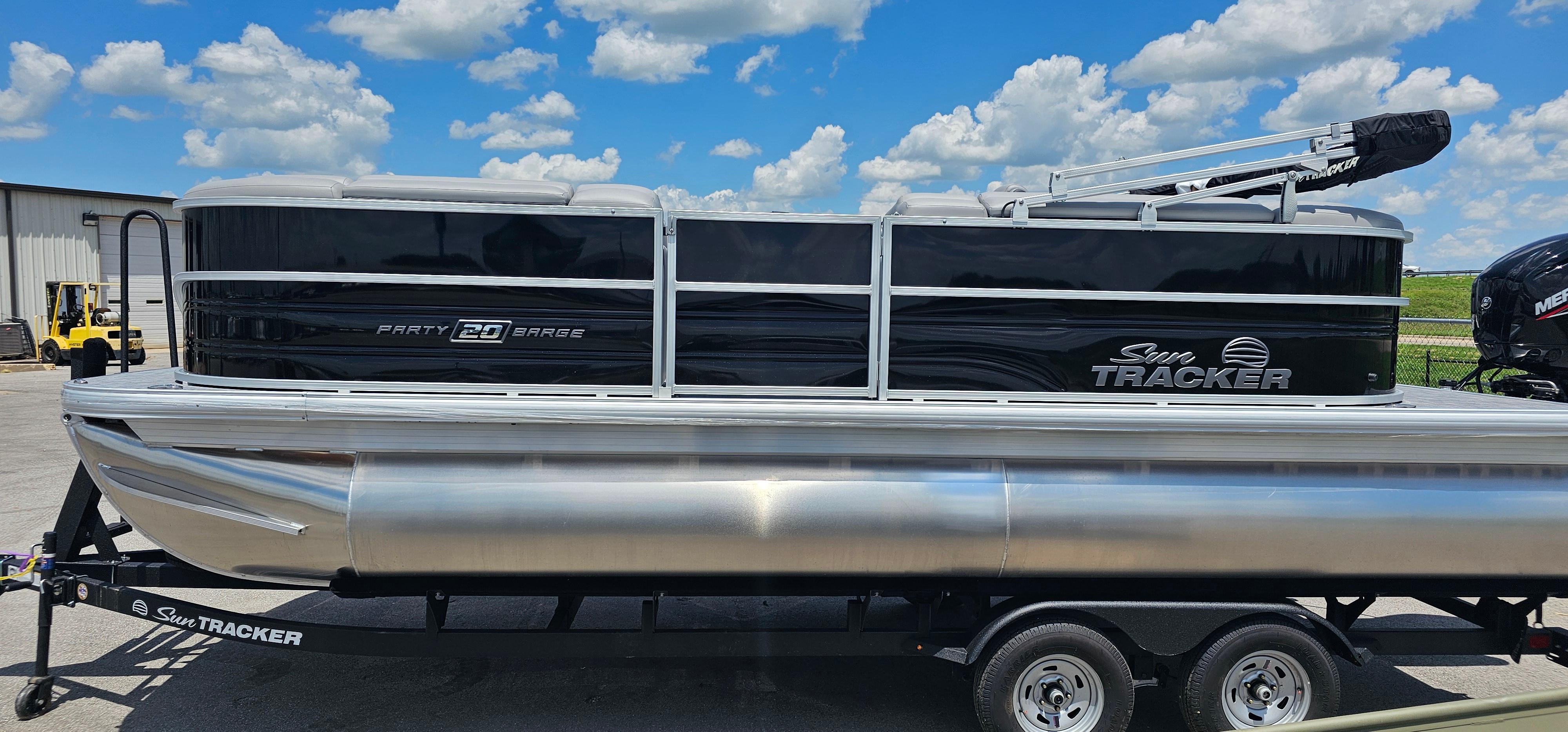 Sun Tracker PB-20 2026 Sun Tracker PB-20 pontoon boat on trailer under a blue sky.