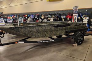 Tracker Grizzly 1650 T Prairie Wings Edition 2025 Tracker Grizzly 1650 T Prairie Wings Edition boat displayed in a showroom.