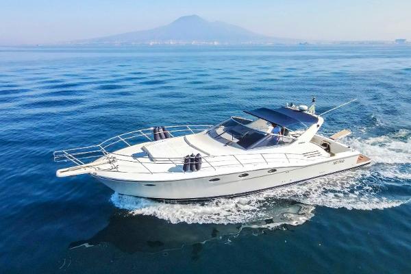 Uniesse 48 Open Uniesse 48 Open yacht cruising on blue waters, 1996 model.