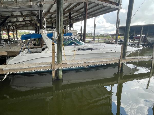 Sea Ray 400 Express Cruiser 1993 Sea Ray 400 Express Cruiser docked in a covered marina.