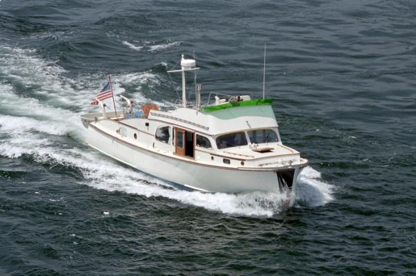 Monk Flybridge Sedan 1946 Monk Flybridge Sedan cruising on the water.