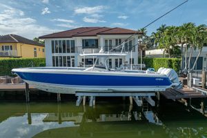 Intrepid 400 Center Console 2016 Intrepid 400 Center Console boat docked by waterfront home.