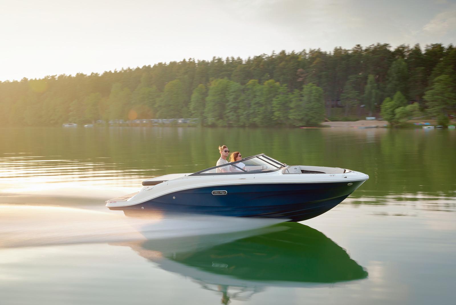 Sea Ray SPX 190 Outboard 2025 Sea Ray SPX 190 Outboard cruising on a serene lake at sunset.