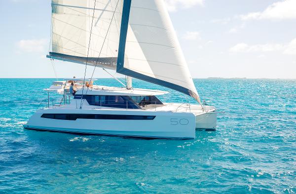 Leopard 50 Sailing catamaran Leopard 50, 2025 model, cruising on clear blue ocean waters.