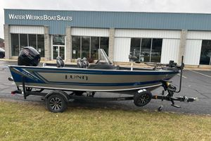 Lund 1875 Impact XS SS 2026 Lund 1875 Impact XS SS boat on trailer outside Water Werks Boat Sales.