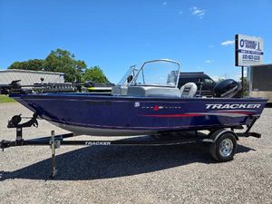 Tracker Pro Guide V-16 WT 2018 Tracker Pro Guide V-16 WT boat on trailer, parked outdoors under clear blue sky.