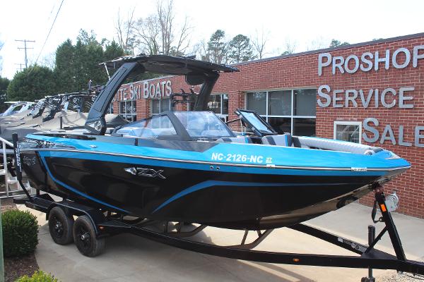 Tigé 23ZX 2023 Tigé 23ZX boat on trailer outside Proshop Service Sales building.