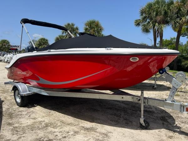 Bayliner Element M19 2024 Bayliner Element M19 boat in red on a trailer.