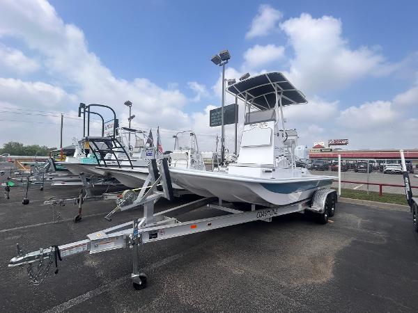 Shallow Stalker CAT211PRO 2025 Shallow Stalker CAT211PRO boat on trailer in parking lot under cloudy sky.