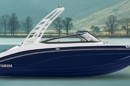 Yamaha Boats 195S 2026 Yamaha Boats 195S, sleek design, blue hull, modern wakeboard tower, serene lake backdrop.
